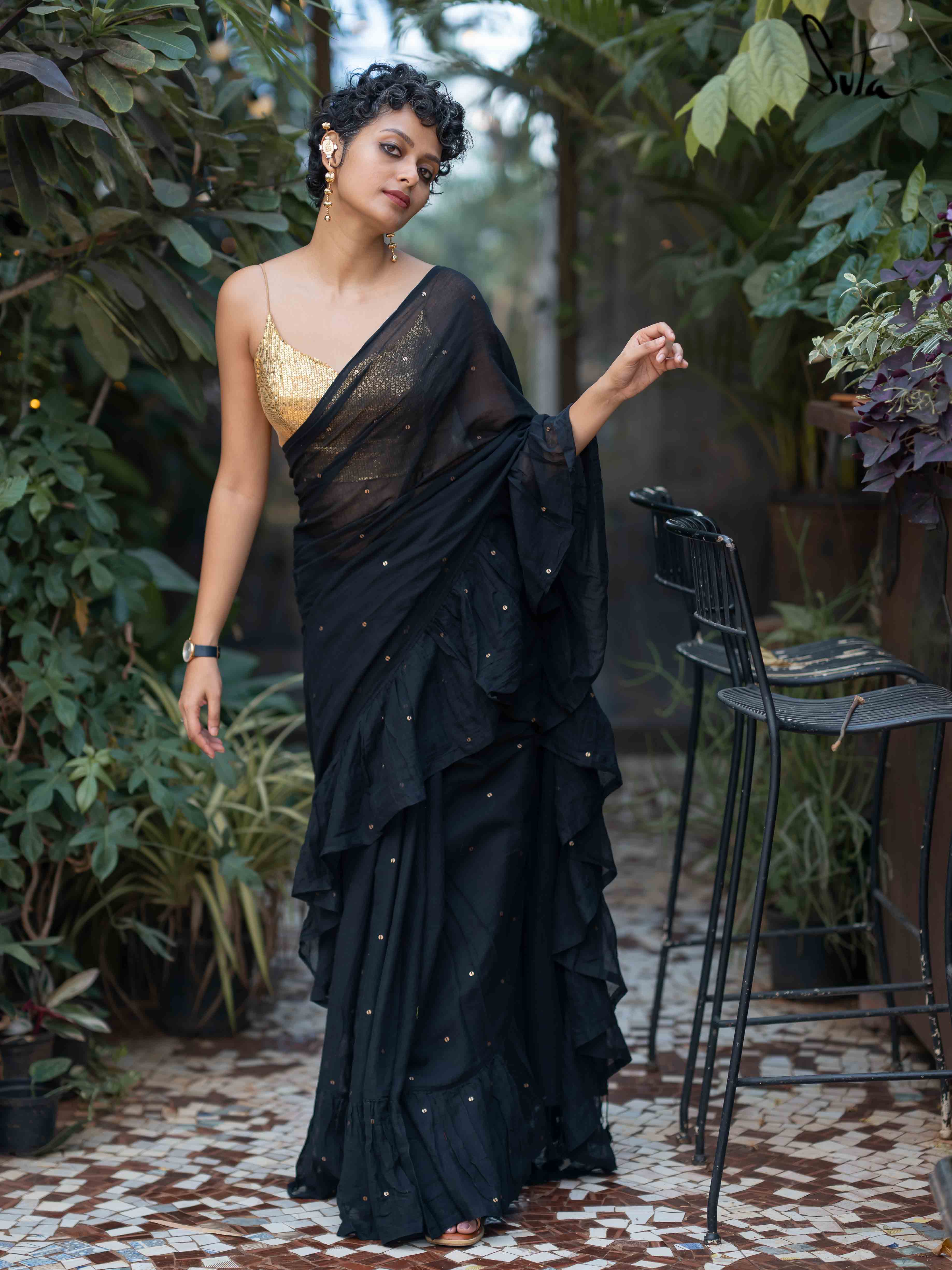 Beautiful black saree with super stylish lace blouse with mirror work  paired with a black georgette saree with ruffle … | Trendy sarees, Black  saree, Blouse designs