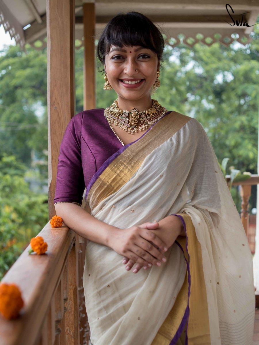 Beige Embroidered Saree and Purple Blouse